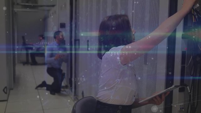 Digital composite of three technicians working in a server room