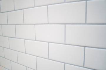 White subway tile with gray grout .