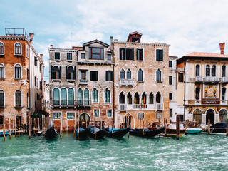 Fototapeta na wymiar Gondolas and houses in Venice, summer