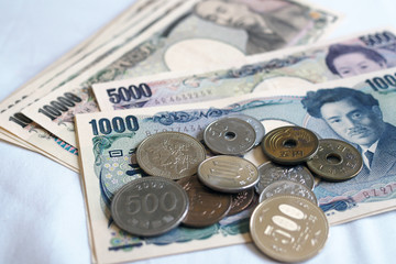 Japanese yen notes and Japanese yen coins for money concept background