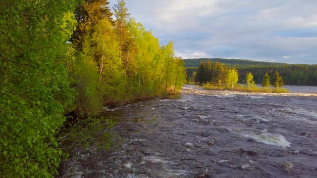 Stormy Glomma River in the forest in county in Norway