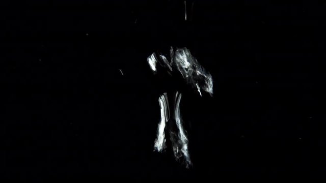 A water element, isolated Bubbles streaming upon a black background. 4K BLACK MAGIC. Professionally filmed real VFX. Camera fixed, neutral angle, close up shoot. (TOKYO, JAPAN - 5th May 2019).