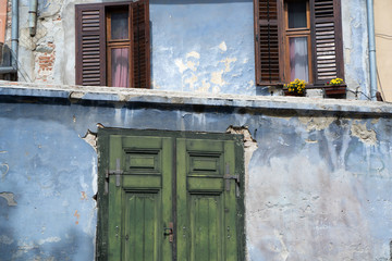 Fototapeta na wymiar Old house with green door in Sibiu County, Transylvania 