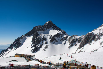 view form top of Jade Dragon Snow Mountain with people travel on the top of Jade dragon snow...