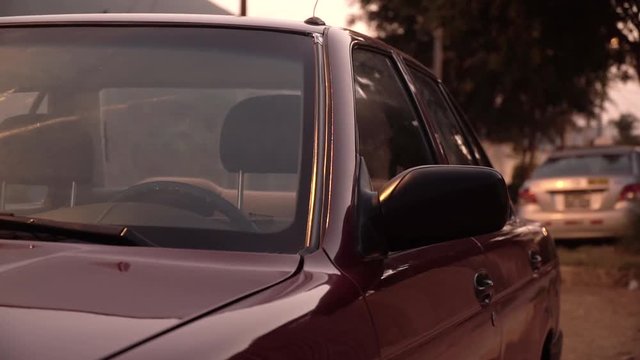 Front seat of an old car during sunset in La Molina, Lima, Peru EXTERIOR VIEW
