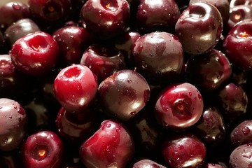 sweet cherry  macro background. Red ripe sweet cherry close-up in drops of water.