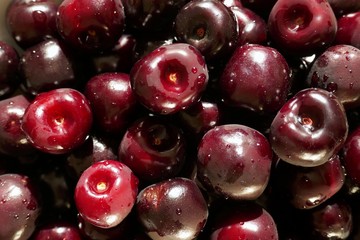 sweet cherry berry macro background. Red ripe sweet cherry close-up in drops of water.