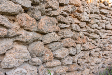 old stone wall background. Texture rock wall of ancient wall.
