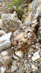 Texture of natural stone. Modern background. Image. Design for poster. Abstract backdrop. Black, grey, biege, sepia. Hole on the surface. Patterns and textures of rocks in nature. Closeup detail stone