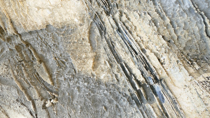 Texture of natural stone. Modern background. Image. Design for poster. Abstract backdrop. Black, grey, biege, sepia. Hole on the surface. Patterns and textures of rocks in nature. Closeup detail stone