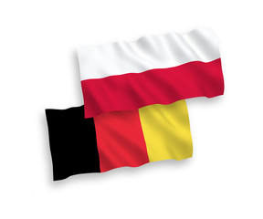 National vector fabric wave flags of Poland and Belgium isolated on white background. 1 to 2 proportion.