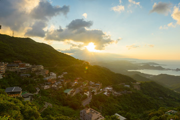 Fototapeta premium Panoramic view of Hillside Jiufen old village with blue sky in New Taipei City, Taiwan
