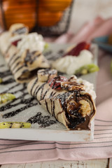  banana wrap with chocolate and fruits 
