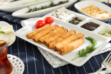 Sunday home breakfast Turkish breakfast with borek and olives, cheese 