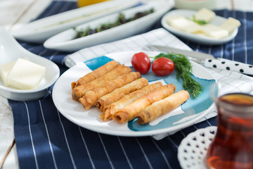 Sunday home breakfast Turkish breakfast with borek and olives, cheese 