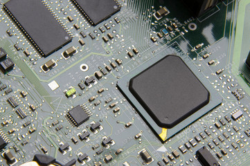 green computer video board with a processor, microcontroller, smd circuit in oblique light