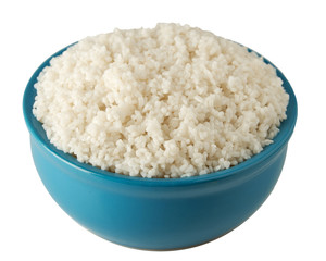 Blue plate full of white boiled rice with slide isolated on white