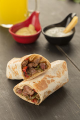 gourmet sliced tortilla roll, burittos, meat wraps with French fries
