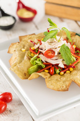 Taco Salad in a Tortilla Bowl with chicken and peppers 