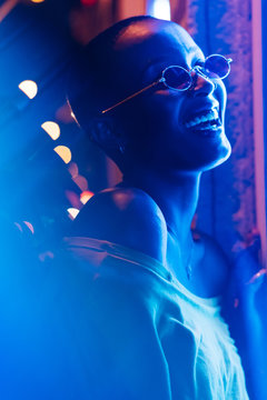 Woman under neon light