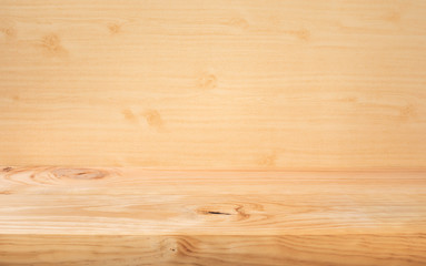 Selective focus.Empty wood table top on wood wall background