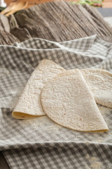 Lavash, tortilla, lavaş, flat and thin bread on table 