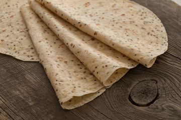 Lavash, tortilla, lavaş, flat and thin bread on table 