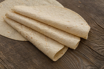 Lavash, tortilla, lavaş, flat and thin bread on table 
