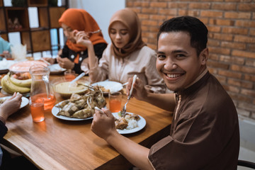 Portrait young father smiling when look at camera in the dining room