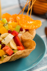 fruit salad in eatable tortilla bowl is a fun and colorful way to eat or diet