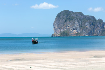 A boat makes its way to Pak Meng beach, trang province, Thailand