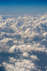 White clouds and sky, a view from airplane window