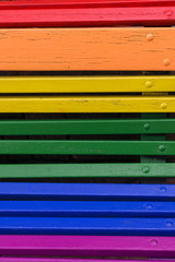 Pride day concept. Wood from a bench painted in rainbow colors