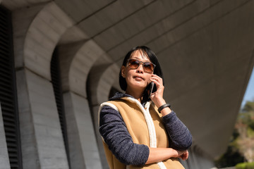 Asian mature beauty talk on the cellphone