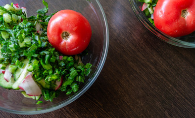 Fresh vegetable salad. Food photo. Tomato, cucumber, chives. The view from the top.