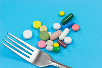 fork among color pills