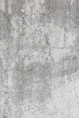 Fototapeta na wymiar The texture of the old grey concrete wall with scratches, cracks, dust, crevices, roughness, stucco. Can be used as a poster or background for design