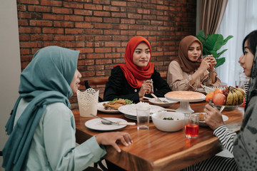 Family members gather in the dining room together when breaking fast in the afternoon