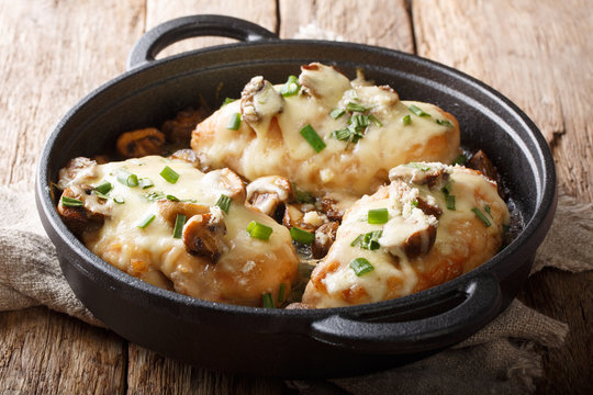  Butter-seared chicken breasts Lombardy with mushrooms and marsala sauce makes for a delicious Italian style dinner closeup in a pan. horizontal