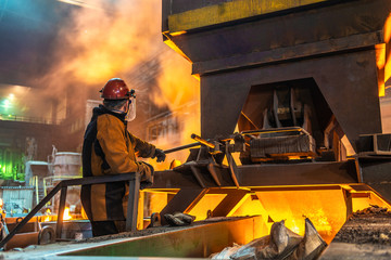 operator working in metallurgical engineering at manufactory of steel plant  