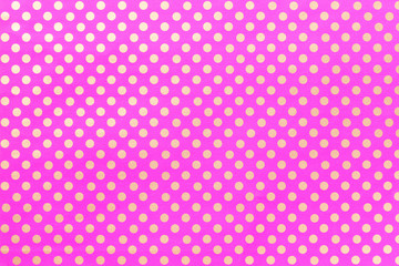 Light purple background from wrapping paper with a pattern of polka dot closeup.