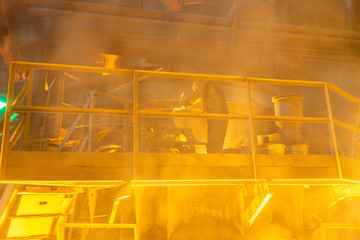 operator working in metallurgical engineering at manufactory of steel plant  