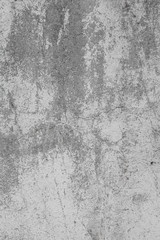 The texture of the old grey concrete wall with scratches, cracks, dust, crevices, roughness, stucco. Can be used as a poster or background for design