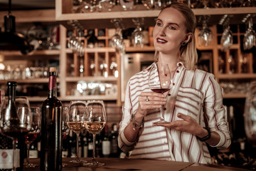 Positive delighted woman being deep in thoughts