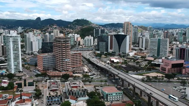 Aerial footage on drone of traffic arriving at Third Bridge toll in Vit&oacute;ria, Esp&iacute;rito Santo, Brazil. Beautiful day on a tropical city.