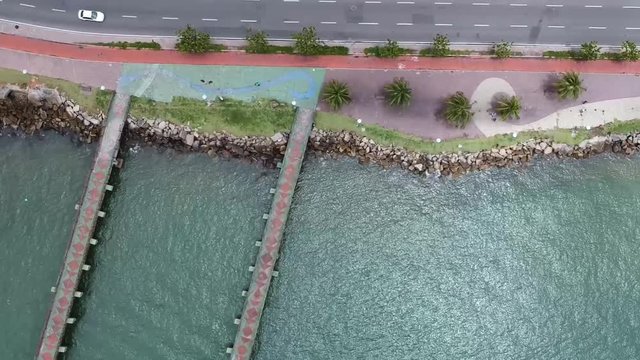 Bird eye view from a pier on a Brazilian beach in Vit&oacute;ria, Esp&iacute;rio Santo. Third Bridge and Shopping Vit&oacute;ria pier.