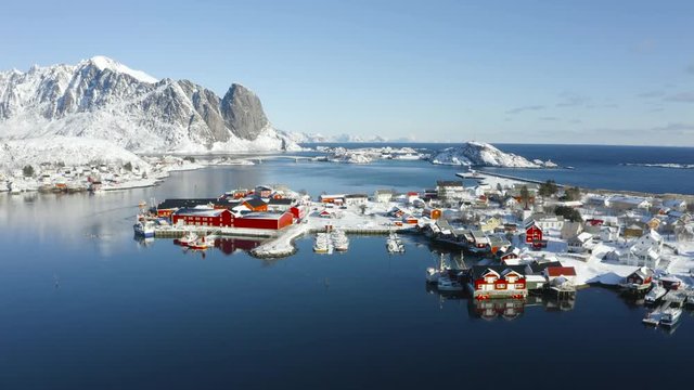 Beautiful drone video of scenic Lofoten Islands archipelago winter scenery with traditional fisherman Rorbuer cabins in the historic villages Reine, Hamnoy, Sakrisoy - Norway, Scandinavia, Europe.