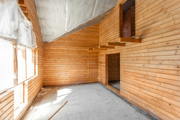 attic floor of the house. overhaul and reconstruction. Working process of warming inside part of roof. House or apartment is under construction, remodeling, renovation, restoration.