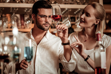 Concentrated brunette male person staring at glass