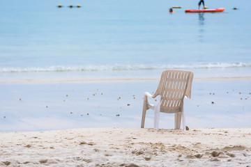 Empty Chair on the beach  at Vongdeuan beach sunset in the Koh Samet island, Rayong, Thailand.